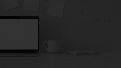 mug and laptop on a desk